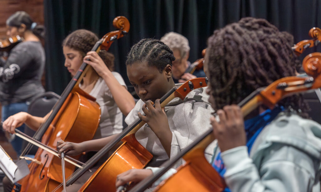 Cellist girls concentrating